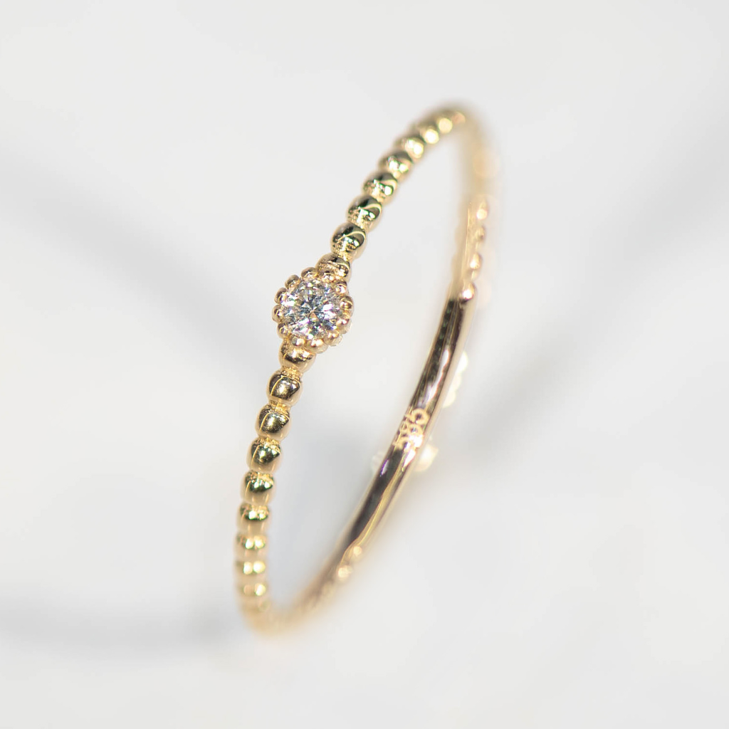 Geelgouden Bolletjesring met Diamant 0,03 karaat VS/GH